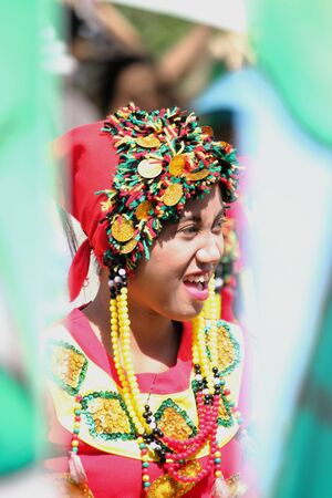 Davao City, Philippines-August 2014: Streetdancing participant partially hidden by props at the parade. Kadayawan is celebrated August each year to give thanks for life and an abundant harvest.のeditorial素材