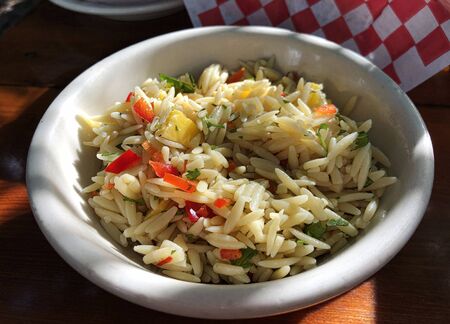 Small white bowl filled with rice saladの写真素材