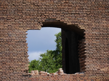 Medium wide side view shot of the entrance to Fort Jefferson, Dry Tortugas National Park in Florida, with the fort reflected in the moat waters.のeditorial素材
