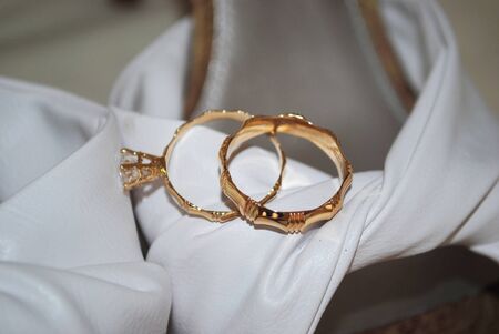 Pair of wedding rings, with soft backgroundの写真素材