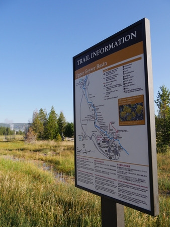 Wyoming, USA--July 2018: Side view of an information board on the Upper Geyser Basin trails at Yellowstone National Park in Wyoming.のeditorial素材