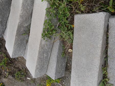 Broken concrete steps on a sloping areaの写真素材