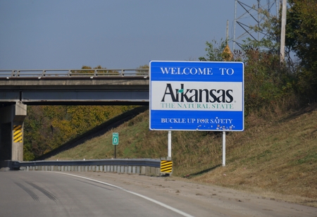 Wide shot of the Welcome to Arkansas welcome sign at Highway 64 past Oklahoma border.のeditorial素材
