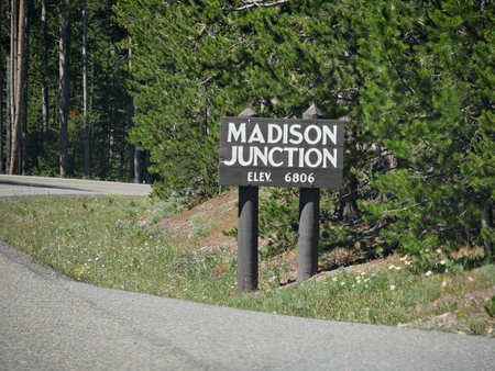 Roadside directional sign to Madison Junction with elevation information at Yellowstone National Park, Wyoming.のeditorial素材