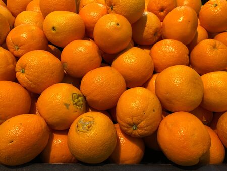 Close up of a pile of oranges at a fruit stall