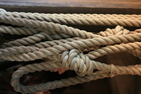 Strong strands of rope on the side of a dock
