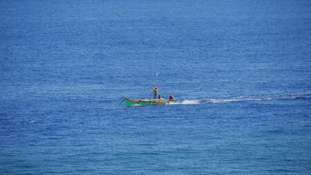 Governor Generoso, Davao Oriental, Philippines-March 2016: Wide shot with a fishing boat and...