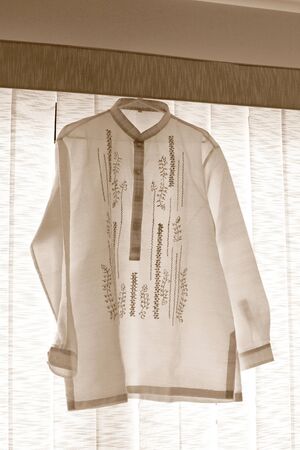 Barong Tagalog for the groom, an embroidered formal shirt and a national dress of the Philippines.の写真素材