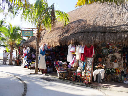 Costa Maya, Mexico- January 2018: Thatch-roofed cotages housing vast displays of colorful souvenir items at the cruise ship terminal in Costa Maya.のeditorial素材