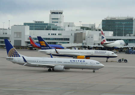 Denver, Colorado-March 2018: Different airplanes at the airport grounds of Denver International Airport.のeditorial素材