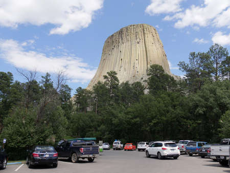 Crook County, Wyoming- July 2018: Wide shot of the parking lot with cars at the foot of the Devils Tower, America's first national monument, Wyoming. のeditorial素材