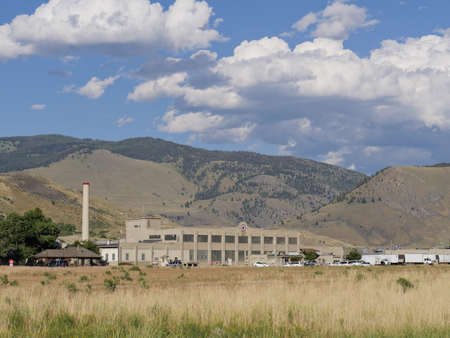 Gardiner, Montana- July 2018: Gardiner landscape with buildings at the foot of the mountains.のeditorial素材