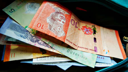 Kuala Lumpur, Malaysia- March 2018: Pile of asorted Malaysian Ringgits of different denominations.