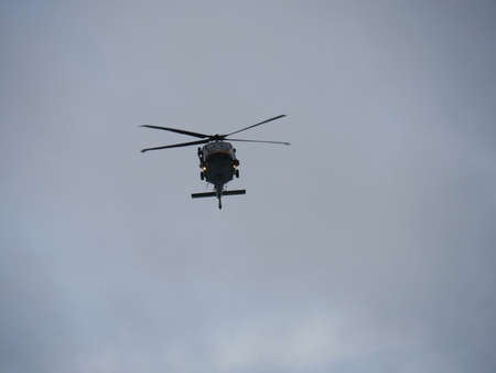 Miami, Florida- December 2018: Wide upward shot of a helicopter flying in the skies.