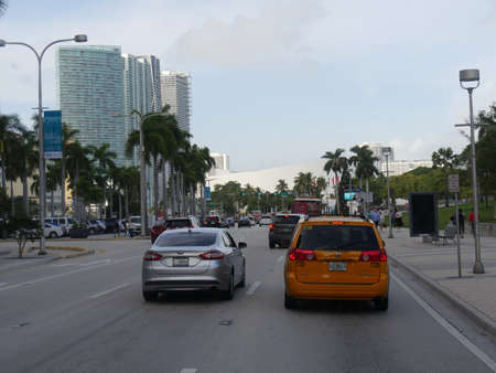 Miami, Florida- December 2018: Street shot in Miami with cars traveling on the road.のeditorial素材