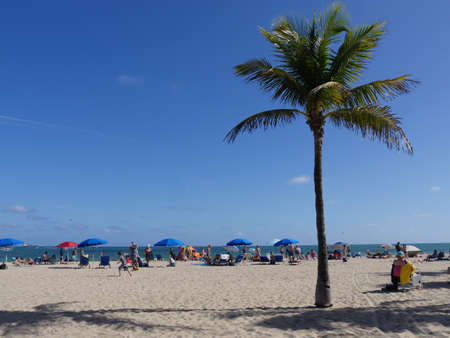 Miami, Florida- December 2018: White sand Miami Beach with beachgoers scattered on the shores.のeditorial素材