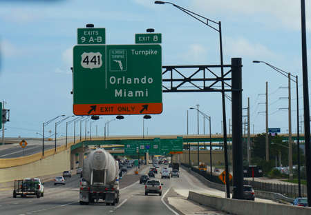 Miami, Florida- December 2018: Street shot with directional signs to Orlando and Miami.のeditorial素材