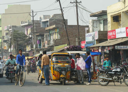 Mathura, Uttar Pradesh, India- March 2018: Busy street scene with people and rickshaws on the streetside in Agra.のeditorial素材