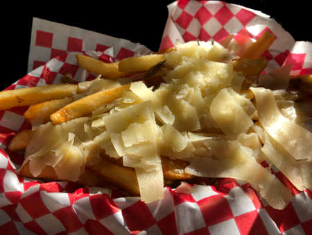 French fries with strips and slabs of cheese