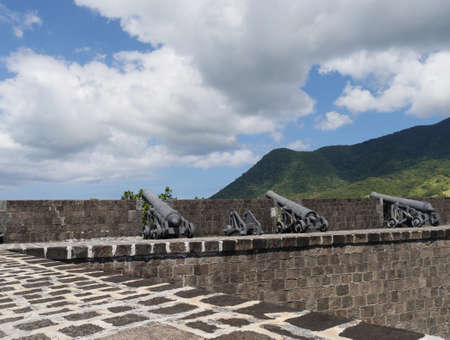 Canons facing the ocean and hills at the Brimstone Hill National Fortress in St. Kitts, West Indies