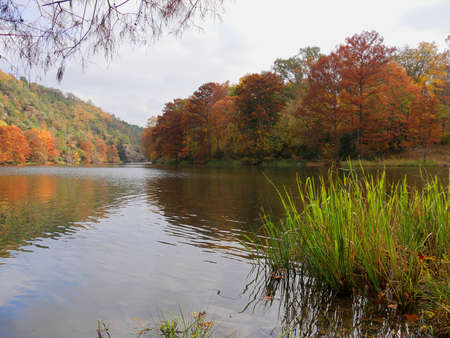 Popular Mountain Forks River at the Beavers Bend State Parks in Broken Bow, Oklahoma with colorful foliage in autumnの写真素材
