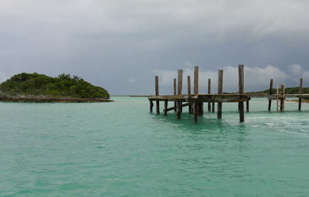 A wooden platform erected in the waters serve as dock to visiting boats in one of the islands in the...