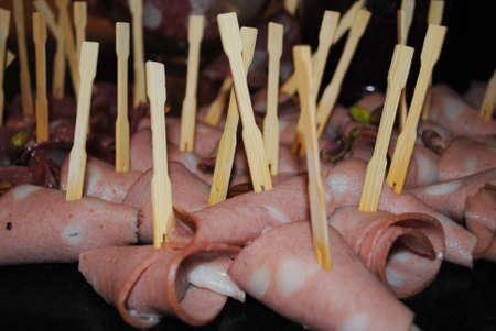 Rolled slices of ham stuffed with cheeseの写真素材
