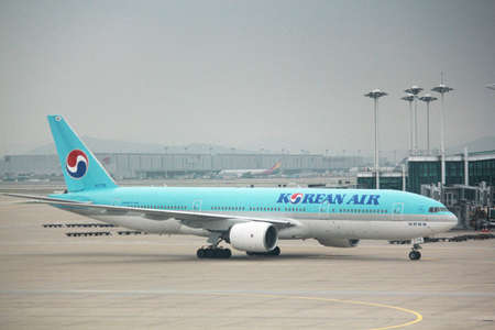 INCHEON, SOUTH KOREAâAUGUST 2014: A Korean Air airplane arrives at the Incheon International Airport, the biggest airport in South Korea.のeditorial素材