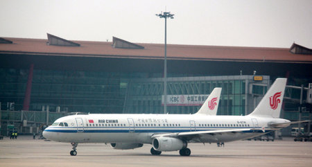 INCHEON, SOUTH KOREAâAUGUST 2014: An Air China Airlines plane gets ready for take off from the Incheon International Airport, the biggest airport in South Korea.のeditorial素材
