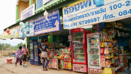 OLD SUKHOTHAI CITY, THAILANDâMARCH 2016: A woman tends to her store outside the bus terminal of Old Sukhothai City early in the morning.のeditorial素材