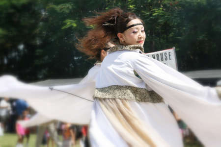 SAIPAN, CNMI-USAâCIRCA OCTOBER 2010: A Japanese woman dancing traditional Japanese dances at the Autumn Festival celebration on Saipan.のeditorial素材