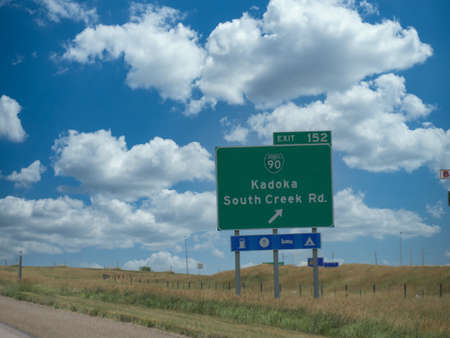 Roadside signs with directions to Kadoka and South Creek Road in South Dakota.の写真素材
