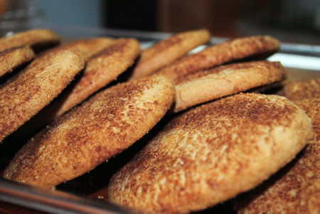 Biscuits with nuts on a baking sheet in the oven.の写真素材