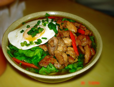 Thai spicy noodle with beef and egg in a bowl.の写真素材