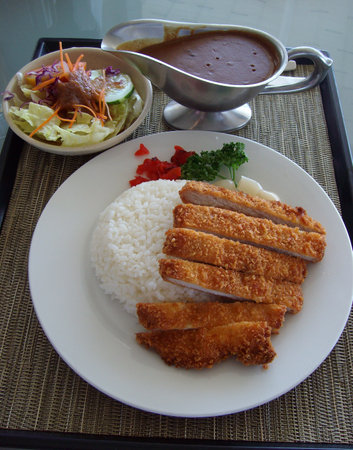 Serving of porkchops, rice and vegetables for side dish.の写真素材