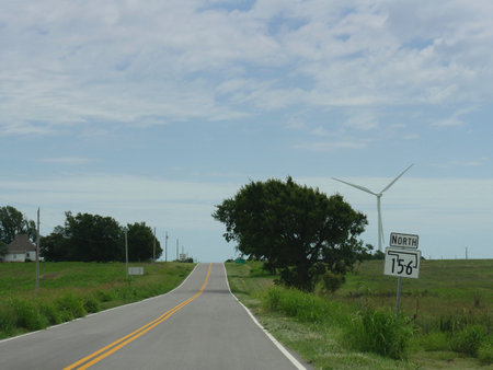 Road signs along the highway in northern Oklahoma with directions to Highway 156 north.の写真素材