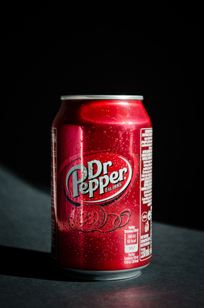 Kyiv, Ukraine - May 28, 2018: Can of Dr Pepper soft cola drink on black background. Dr Pepper is a soft drink marketed as having a unique flavor. The drink was created in the 1880s.のeditorial素材