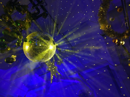 Disco ball with bright rays, night party decorationの写真素材