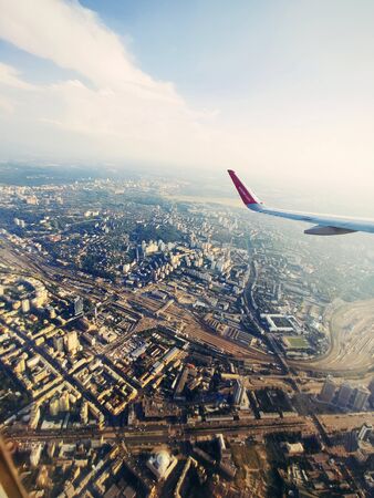 Kyiv, Ukraine - June 24, 2019: Airbus A321 plane of Wizz Air flying over Kyiv city. Aerial view. Wizz air is a low-cost airline with largest fleet in Hungary who serves over 30 countriesのeditorial素材