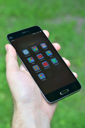 Smartphone Xiaomi Mi 5 with Google applications on the screenのeditorial素材