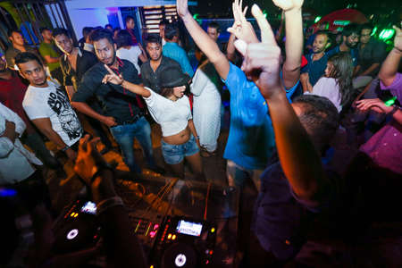 Bangladesh â€“ October 23, 2015: People dancing and enjoying DJ Party at Picasso Restaurant in...