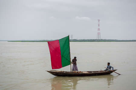 Bangladesh â June 27, 2015: A sailing liner, the water of the Kirtonkhola was flowing 5cm above the danger level of 2.55 metres at Rasulpur, Barisal District.のeditorial素材