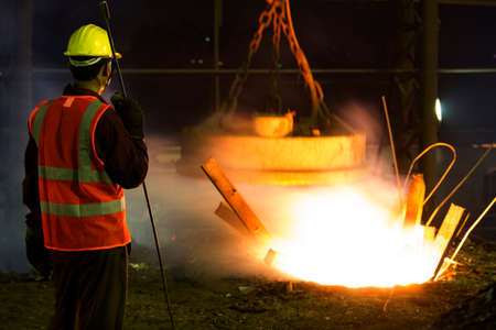 Bangladesh â May 19, 2015: From metal scrap to iron rod making steel factory machine operator at Demra, Dhaka, Bangladesh.のeditorial素材