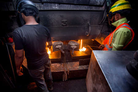 Bangladesh â€“ May 19, 2015: Blast furnace in the melt steel works, risky workers in steel...