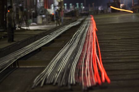 Heated metal pig gets squeezed and drilled at special metal forging unit at Brueck metal forging...