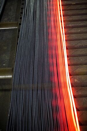 Heated metal pig gets squeezed and drilled at special metal forging unit at Brueck metal forging...