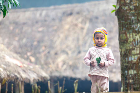 Bangladesh â January 06, 2014: On a foggy winter morning a little kids are wearing winter clothes at Ranisankail, Thakurgaon.のeditorial素材