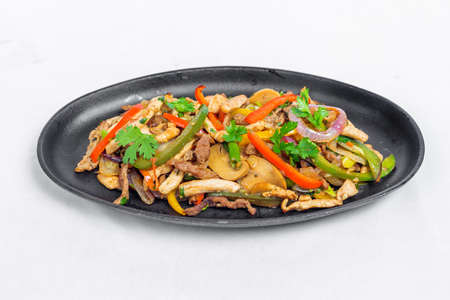 Chicken mushroom and capsicum stir fry recipe served on a sizzling plate. Chicken Fajita Recipe, Asian recipes.の写真素材