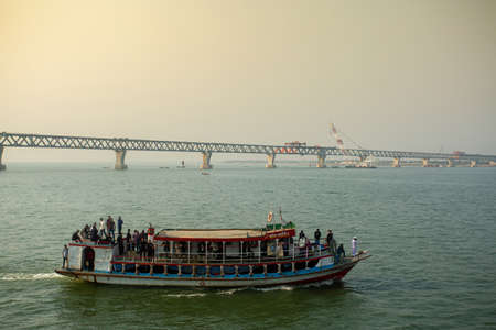 Bangladesh â€“ February 06, 2021: Passenger launches are crossing the river Padma at...