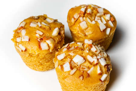 3 pieces popular and yummy traditional cake made with raw ripe palmyra palm fruit juice. Steamed palmyra palm cake in isolated white background.の写真素材